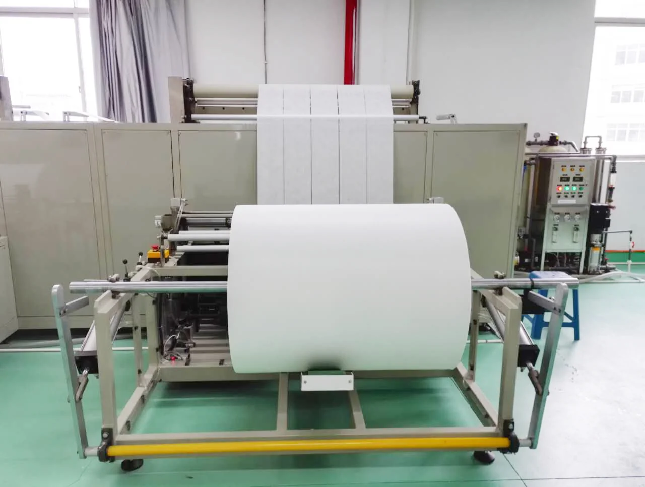 White material rolls feeding a production machine